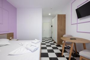 Postel nebo postele na pokoji v ubytování Compas Boutique Hotel