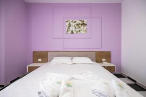Postel nebo postele na pokoji v ubytování Compas Boutique Hotel