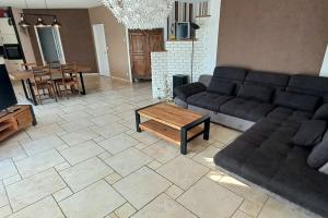 Posezení v ubytování Villa 140 m² hab. avec piscine