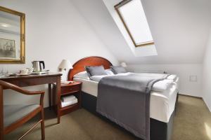 Postel nebo postele na pokoji v ubytování Prague Season Hotel