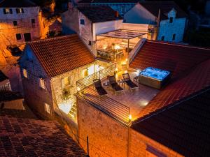 an aerial view of a house with lights on the roof at Villa Nora - Charme Holidays in Sutivan