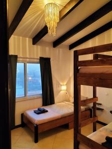 a bedroom with a bunk bed and a chandelier at Solstice in Santa Maria