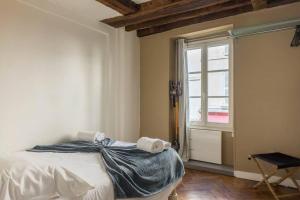 Llit o llits en una habitació de Le Bourgogne-HyperCentre