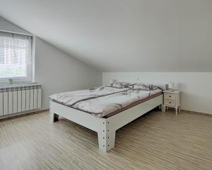 Postel nebo postele na pokoji v ubytování Apartma Hilltop Haven