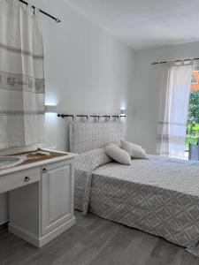 Postel nebo postele na pokoji v ubytování Sa Jacca Albergo Rurale