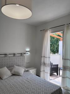 Postel nebo postele na pokoji v ubytování Sa Jacca Albergo Rurale