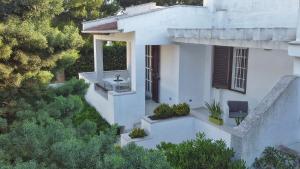 an aerial view of a white house with a garden at Villa Benedetta in Ostuni