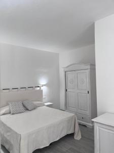 Postel nebo postele na pokoji v ubytování Sa Jacca Albergo Rurale