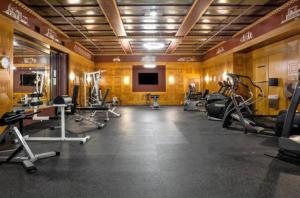 a gym with several treadmills and machines in a room at Executive Vacation Suite for 4 in Indianapolis