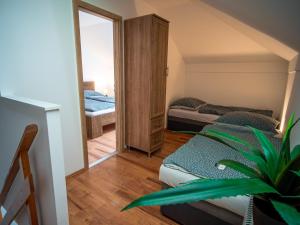 Posteľ alebo postele v izbe v ubytovaní Duna Apartments Štúrovo