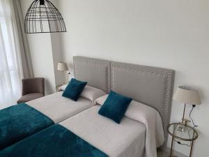 Giường trong phòng chung tại Apartamento Los Nardos