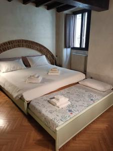 Posteľ alebo postele v izbe v ubytovaní Torre dei Sapiti Apartment