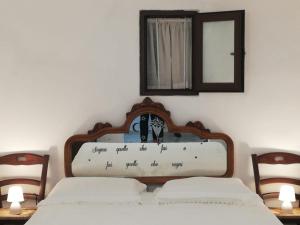 Posteľ alebo postele v izbe v ubytovaní Ciao b&b