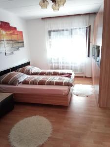 מיטה או מיטות בחדר ב-Apartment Menesa