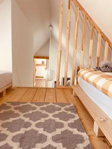 a bedroom with a bed and a wooden floor at INGLOTÓWKA in Wołów