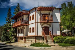 a large house with a balcony on the side of it at комплекс Щастливците in Starozagorski Bani