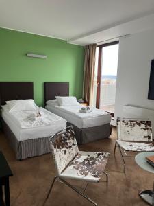 Ένα ή περισσότερα κρεβάτια σε δωμάτιο στο Hotel Beroun Golf Club