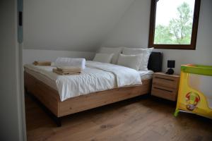 En eller flere senge i et værelse på Drinska Zora