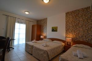 Postel nebo postele na pokoji v ubytování Palates Hotel