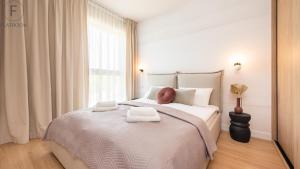 Giường trong phòng chung tại Flatbook - Seaside Apartments Porto Gdańsk +26 ảnh