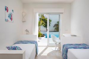Posteľ alebo postele v izbe v ubytovaní Bahiazul Resort Fuerteventura