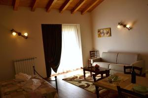 a living room with a couch and a table at Agriturismo Gradec in Aurisina