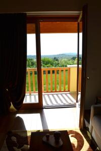 a room with a door open to a balcony at Agriturismo Gradec in Aurisina