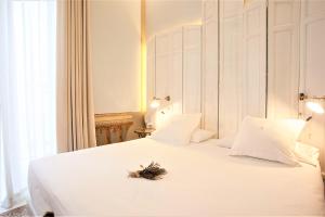 Postel nebo postele na pokoji v ubytování Hotel Madinat