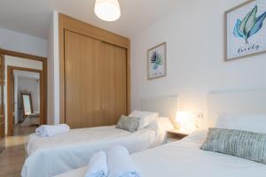 Posteľ alebo postele v izbe v ubytovaní Apartamento Planta Baja Coto Sancti Petri Playa de la Barrosa