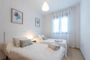 Posteľ alebo postele v izbe v ubytovaní Apartamento Planta Baja Coto Sancti Petri Playa de la Barrosa