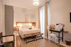 Postel nebo postele na pokoji v ubytování Hotel Madinat