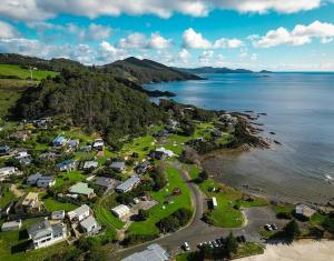 an aerial view of a resort on the shore of the ocean at Seascape Beach House in Boat Harbour