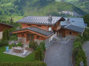 an aerial view of a wooden house with a patio at chalet l'Orignal 145m2, 10pers, pied de piste,SPA in Notre-Dame-de-Bellecombe