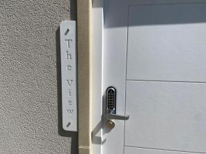 a close up of a metal door with the word privacy at The View, Luxury studio in Curbar