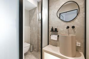 a bathroom with a sink and a mirror at Castello studios in Agia Anna Naxos