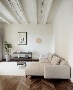a living room with a couch and a table at Trabuxu Boutique Living in Valletta