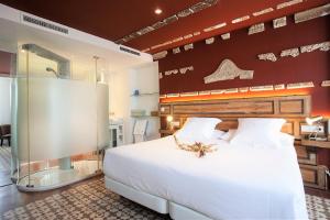Postel nebo postele na pokoji v ubytování Hotel Madinat