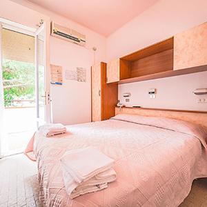 Postel nebo postele na pokoji v ubytování Hotel Rosa