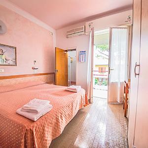 Postel nebo postele na pokoji v ubytování Hotel Rosa