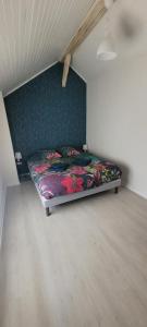 a bedroom with a bed in the corner of a room at la maison de l'abeille de Percey in Percey-le-Pautel +38 photos