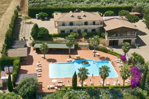 an aerial view of a resort with a swimming pool at Tenuta Colle Degli Ulivi in Sibari