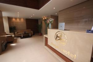 a lobby of a hotel with a reception desk at Perfectstayz Sagar Near Golden Temple in Amritsar