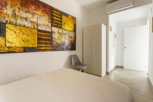 Cama o camas de una habitación en APARTAMENTOS MAPAMUNDI