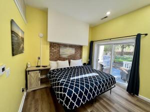 a bedroom with a bed and a large window at New Buffalo Inn & Spa in New Buffalo +4 photos