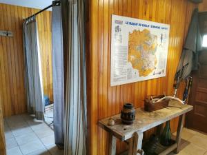 a room with a map on the wall and a table at Chalet cerdan typiques a Dorres proche de Font-Romeu in Dorres