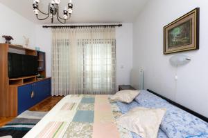 Postel nebo postele na pokoji v ubytování Apartments Anka