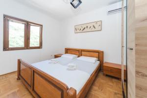 Postel nebo postele na pokoji v ubytování Guest House Zuber