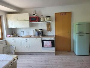 Kuchyň nebo kuchyňský kout v ubytování Ferienwohnung Elbblick