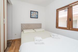 Postel nebo postele na pokoji v ubytování Guest House Zuber