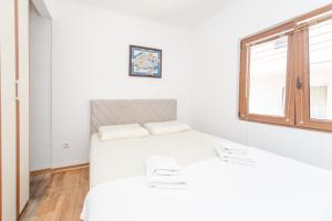 Postel nebo postele na pokoji v ubytování Guest House Zuber